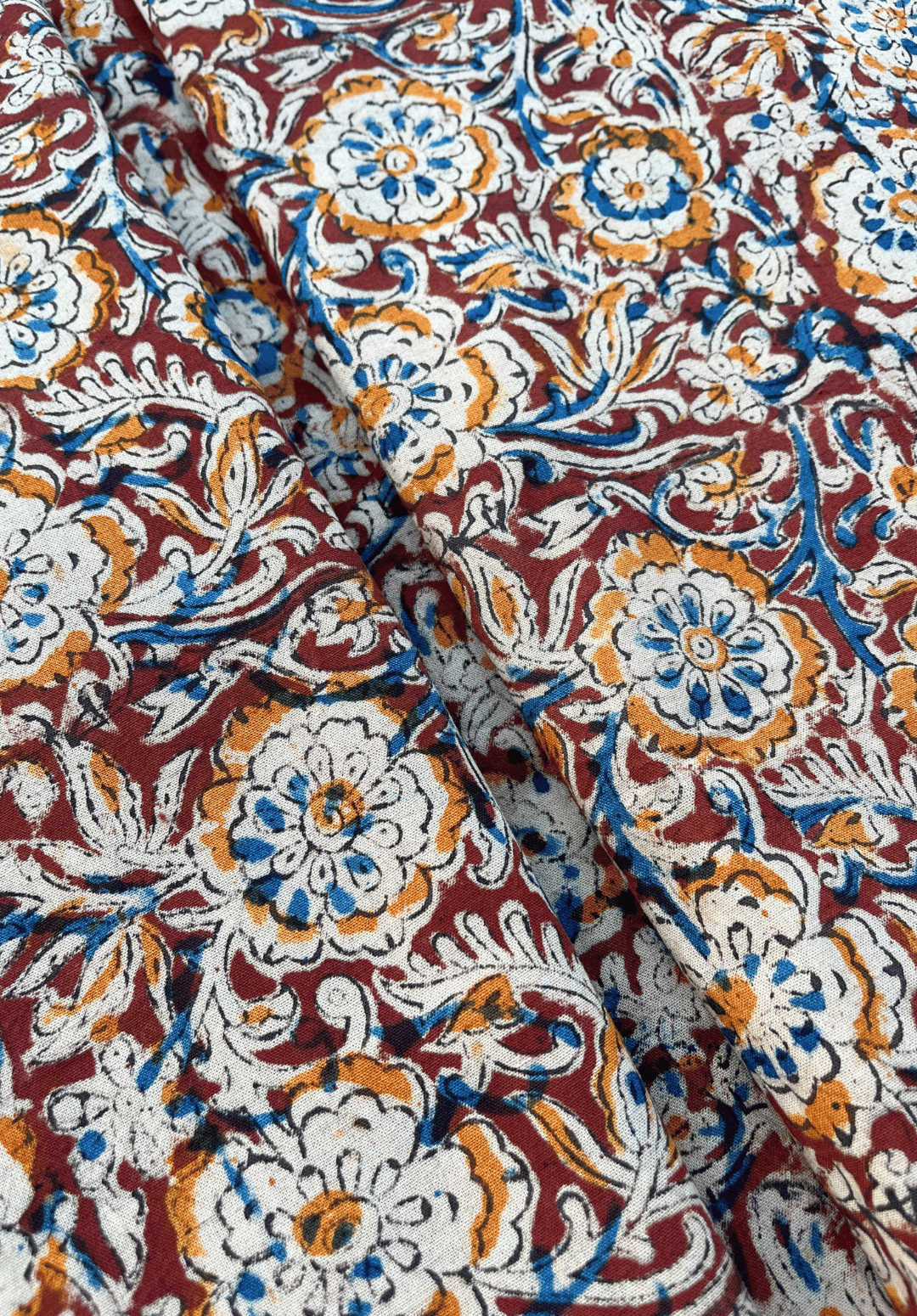 Floral Kalamkari on Maroon Fabric with Blue and Mustard Accents
