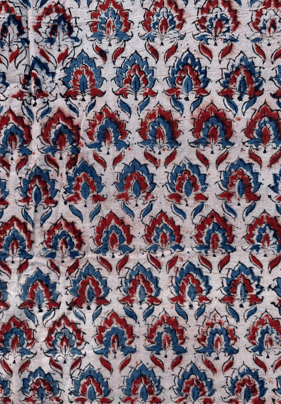 Floral Kalamkari Print on White Fabric with Red and Blue Accents