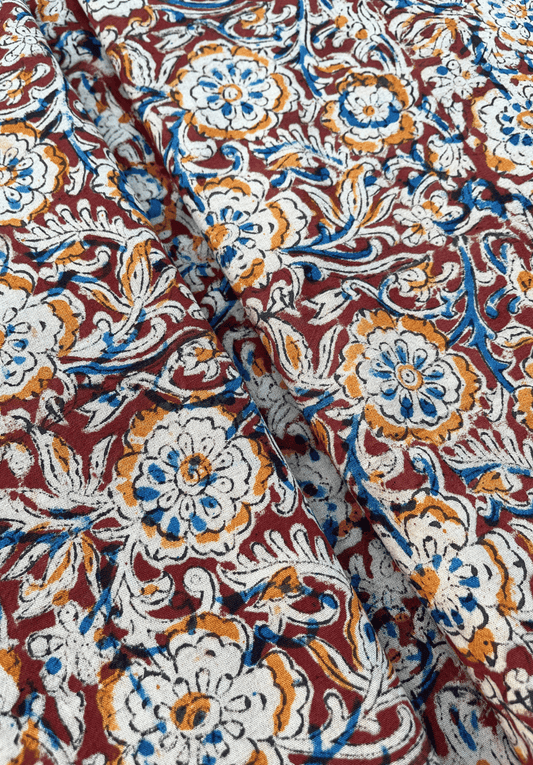 Floral Kalamkari on Maroon Fabric with Blue and Mustard Accents