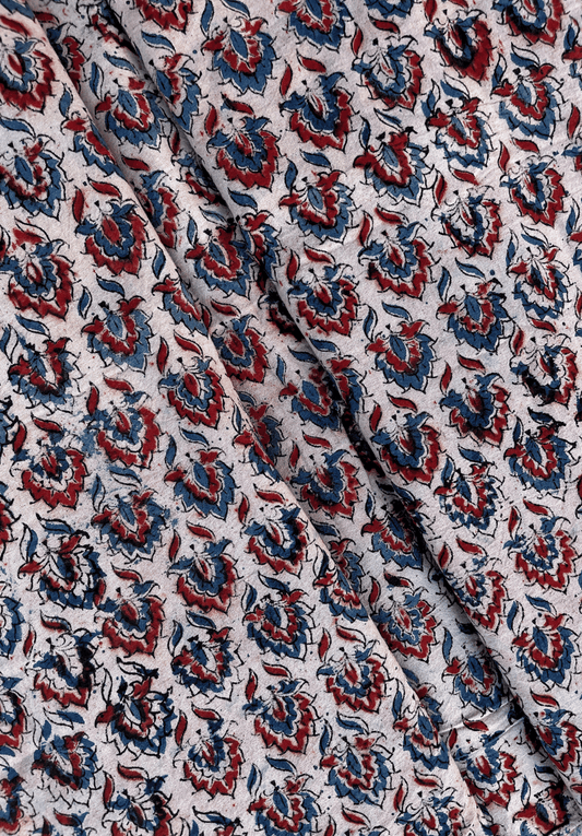 Floral Kalamkari Print on White Fabric with Red and Blue Accents