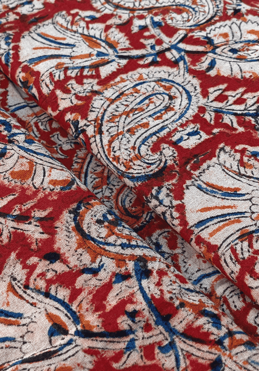 Traditional Kalamkari Fabric with Paisley and Floral Motifs on a Red Background